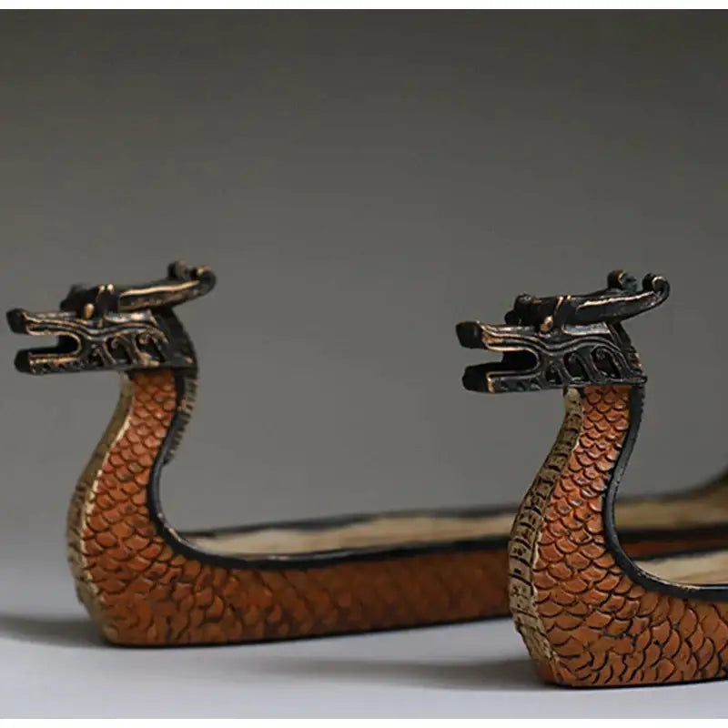 Retro bronze dragon boat incense holder in bronze with detailed scales and ornate heads for living room decorbites decor