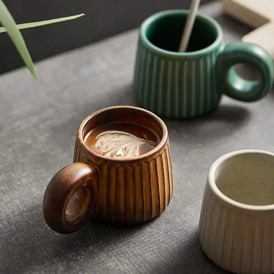 Retro brown ridged ceramic mug with rounded ring handle filled with coffee from decorbites handmade nordic ceramic collection