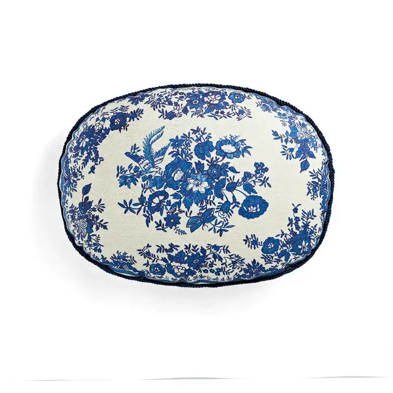 Cream-colored oval pillow cover with blue floral embroidery and navy fringe tassels decorbites circus retro decorbites circus retro pillow cover
