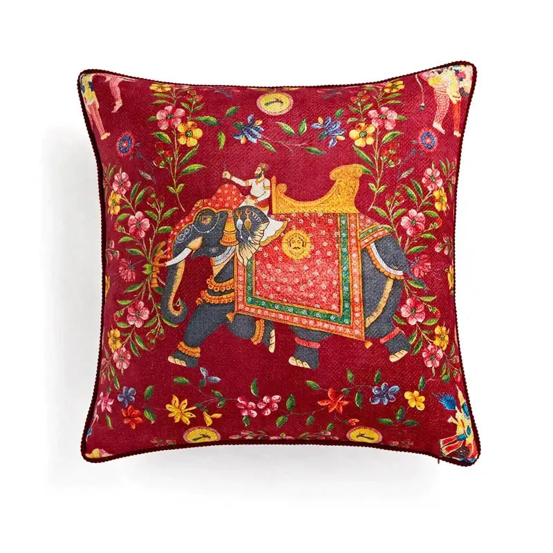 A deep red velvet pillow cover with ornate embroidered elephant and floral patterns for decorbites circus retro decor