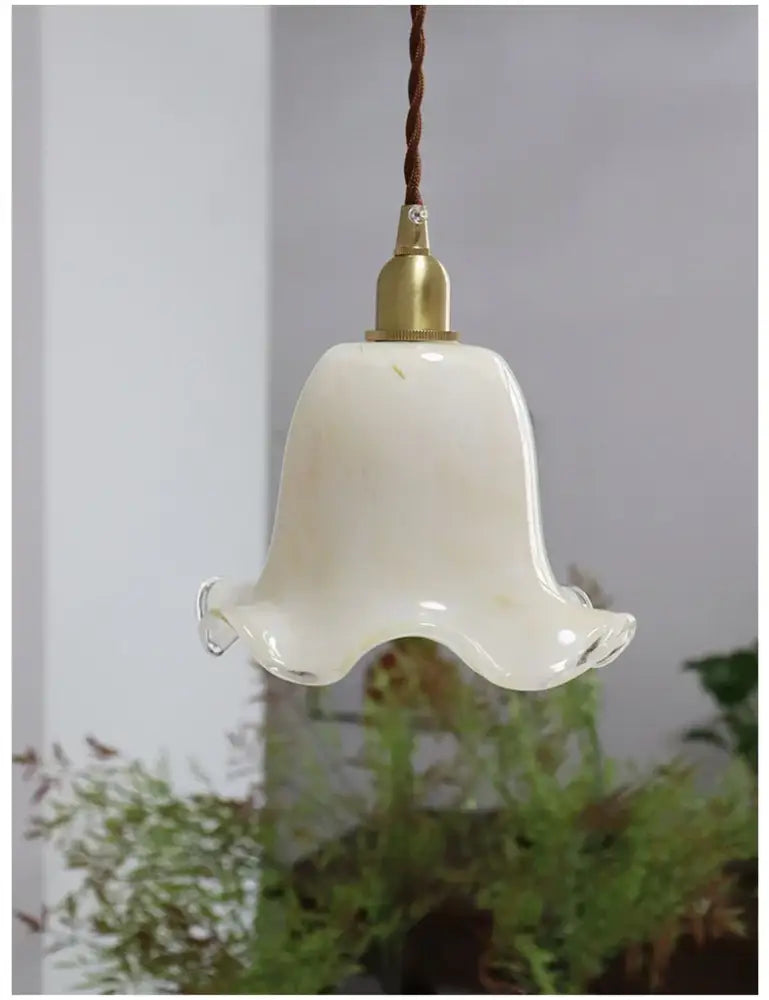 Retro cream glass led pendant lamp with brass finish featuring a cream bell-shaped glass led pendant and twisted brown cord