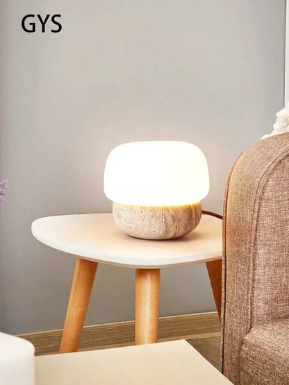 Soft glowing cream mushroom table lamp with textured stone base from decorbites for bedroom decor