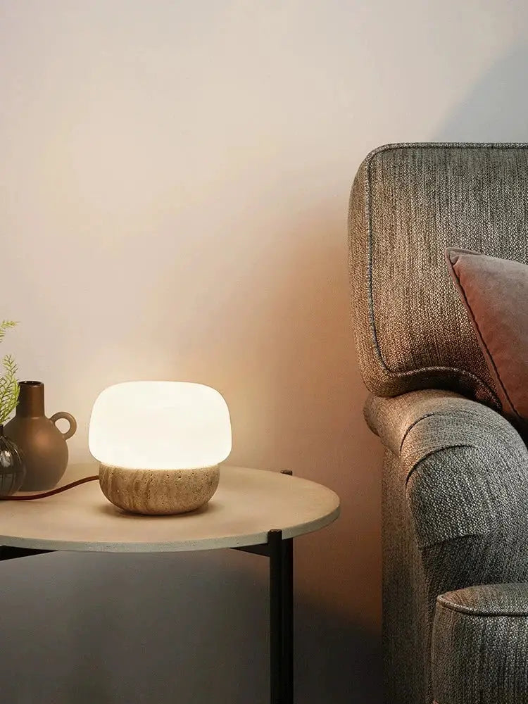 A decorbites cream mushroom table lamp with a smooth white top and textured beige stone base for bedroom decor