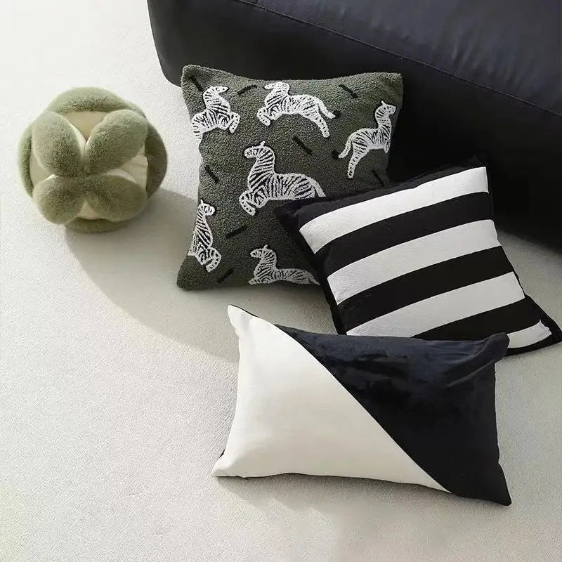Dark green pillow cover with white embroidered zebra patterns and black stripes made of jacquard luxury fabric