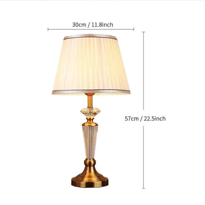 Elegant gold-toned table lamp with pleated cream fabric shade and crystal accents complementing decorbites crystal floor lamp