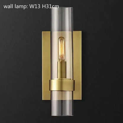 Gold-toned glass chandelier pendant lamp with clear glass cylinder and exposed filament bulb for dining room use