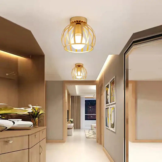 Gold-toned decorbites iron cage retro ceiling lamp with warm glowing bulb for bedroom lighting and decor