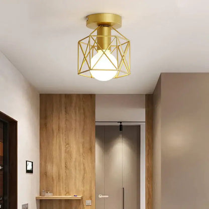 Gold geometric ceiling lamp with decorbites iron cage and frosted glass bulb for warm bedroom lighting