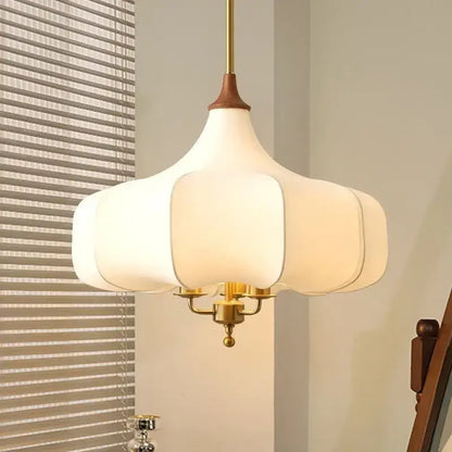 White petal-shaped pendant lights with brass-finished metal frame and wooden top for decorbites gold lustre retro decor