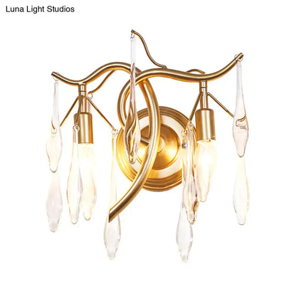 Gold-toned wall lamp with curved metal arms and clear crystal droplets for retro gold raindrop wall mount lighting