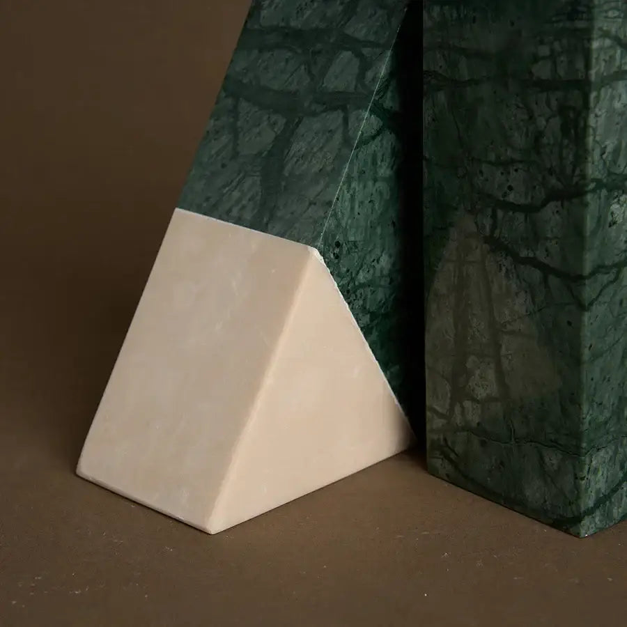 A sleek retro green and beige marble bookend with polished green marble top and cream base for home decor