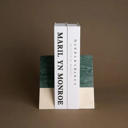 White marble bookends with green marble top and cream base featuring black text spine for home decor by decorbites