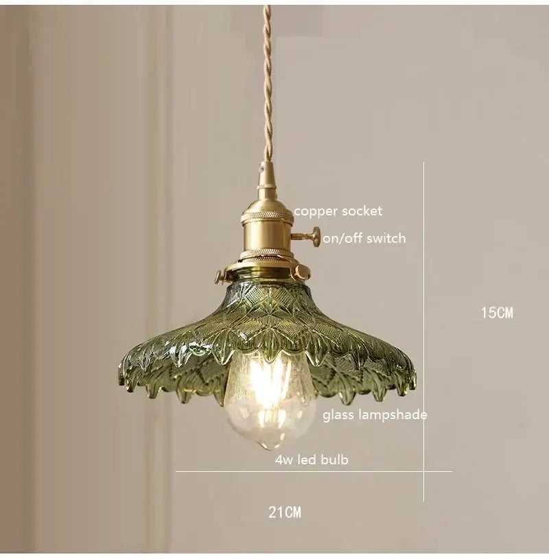 Retro green glass pendant light with wood accent featuring vintage brass hardware and twisted copper cord for dining room use