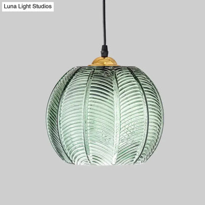 Retro green ribbed glass pumpkin dinette pendant lamp with leaf-like texture and brass fixture for dining room