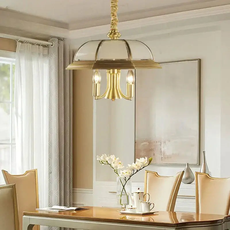 Gold-toned decorbites iron bronze pendant light with glass dome and three candle-style bulbs for living room decor