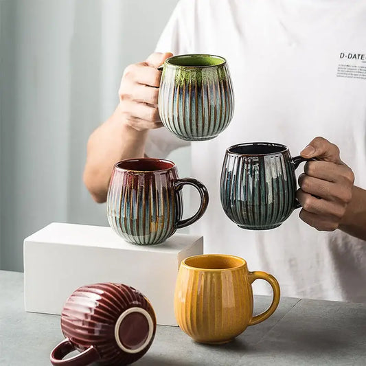 Handcrafted ceramic coffee mug with vertical ribbed texture and earthy gradient glaze for kitchen use