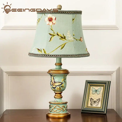 Retro mint green resin table lamp with gold accents and hand-painted butterflies for elegant bedroom decorbites green resin decor