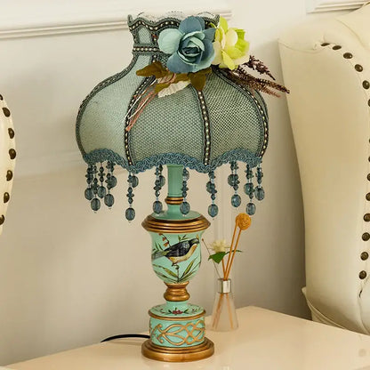 Retro mint green resin table lamp with butterfly detail featuring teal and gold decorbites green resin mesh shade decor