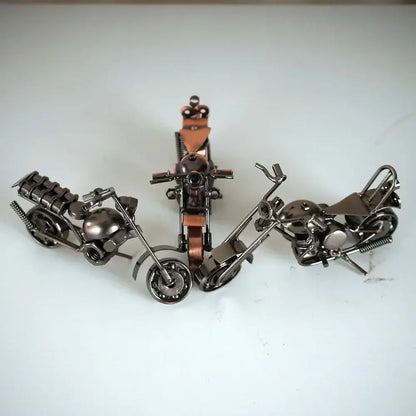 Three dark metallic retro motorcycle model metal figurines with copper leather accents for living room decor