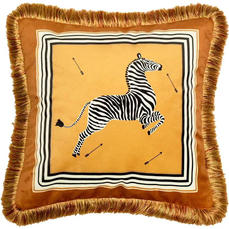A tan velvet cushion cover with fringed border and black and white zebra print on mustard italian retro decorbites design