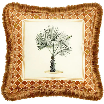 A cream fabric cushion cover with fringed border featuring illustrated palm tree and orange zebra print decorbites italian retro pattern