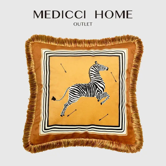 A mustard-yellow cushion cover with black and white zebra print and fringed edges for decorbites italian retro decor