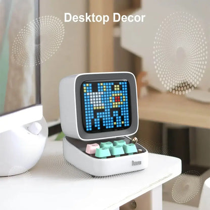 White retro pixel mini speaker and bedroom clock with blue yellow digital display and colorful mint green pink keycaps