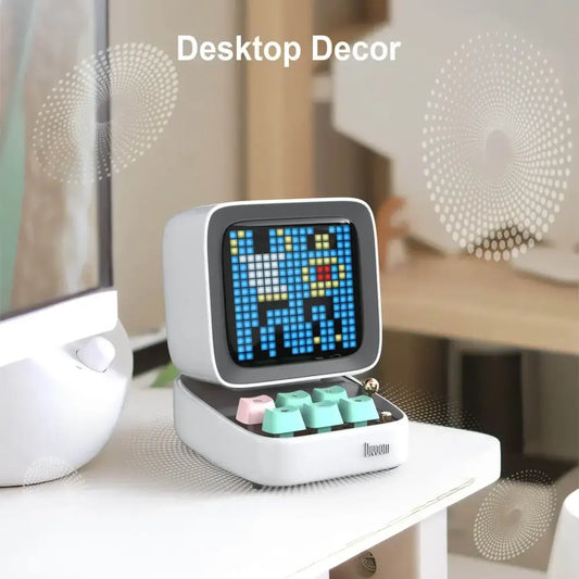 White retro pixel mini speaker and bedroom clock with blue yellow digital display and colorful mint green pink keycaps