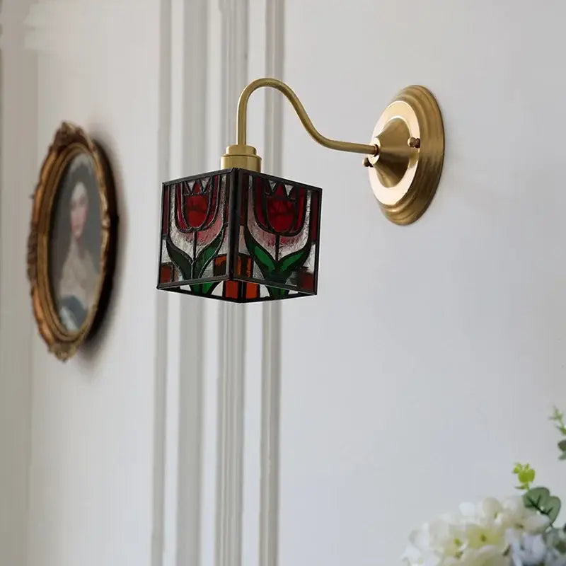 A brass-finished wall sconce with a retro red tulip stained glass cube shade for bedroom decorbites cube led wall lighting