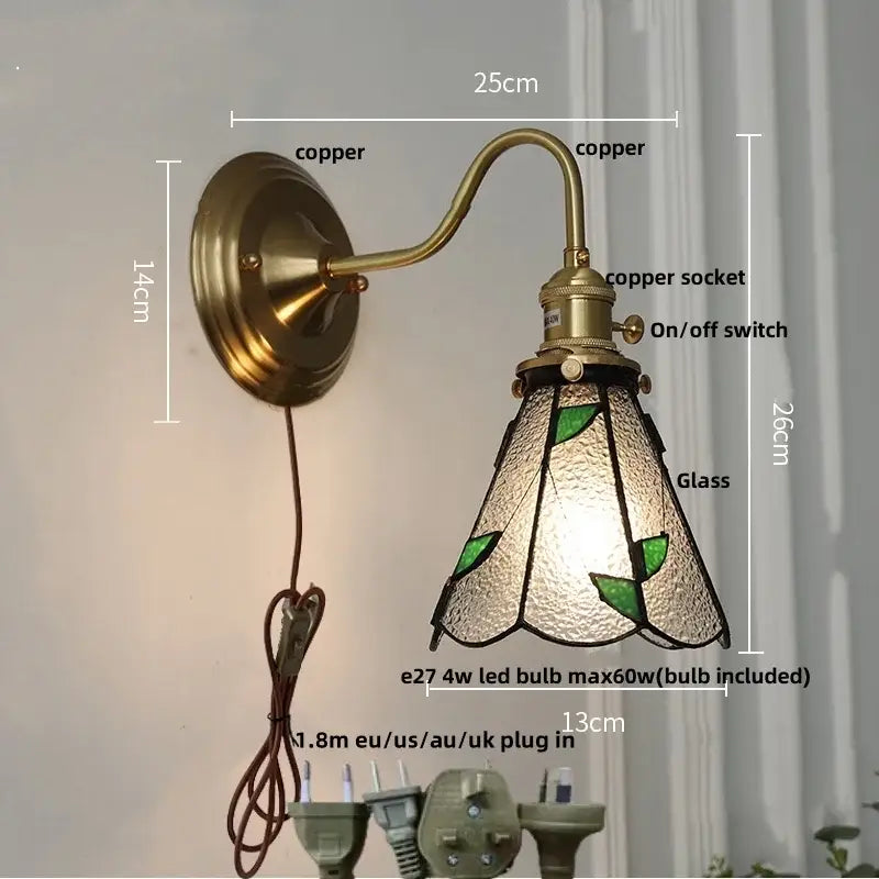 Antique brass-finished wall sconce with green leaf stained glass shade and textured frosted glass cube led wall decorbites cube led