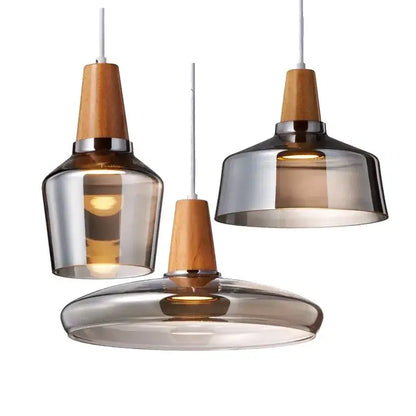 Three modern pendant lights with retro smoked glass lampshade and warm wood accents ideal for kitchen decorbites glass lampshade pendant