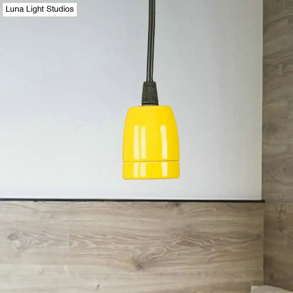 Bright yellow ceramic pendant light fixture with adjustable black cord for red ceramic ceiling by DecorBites™