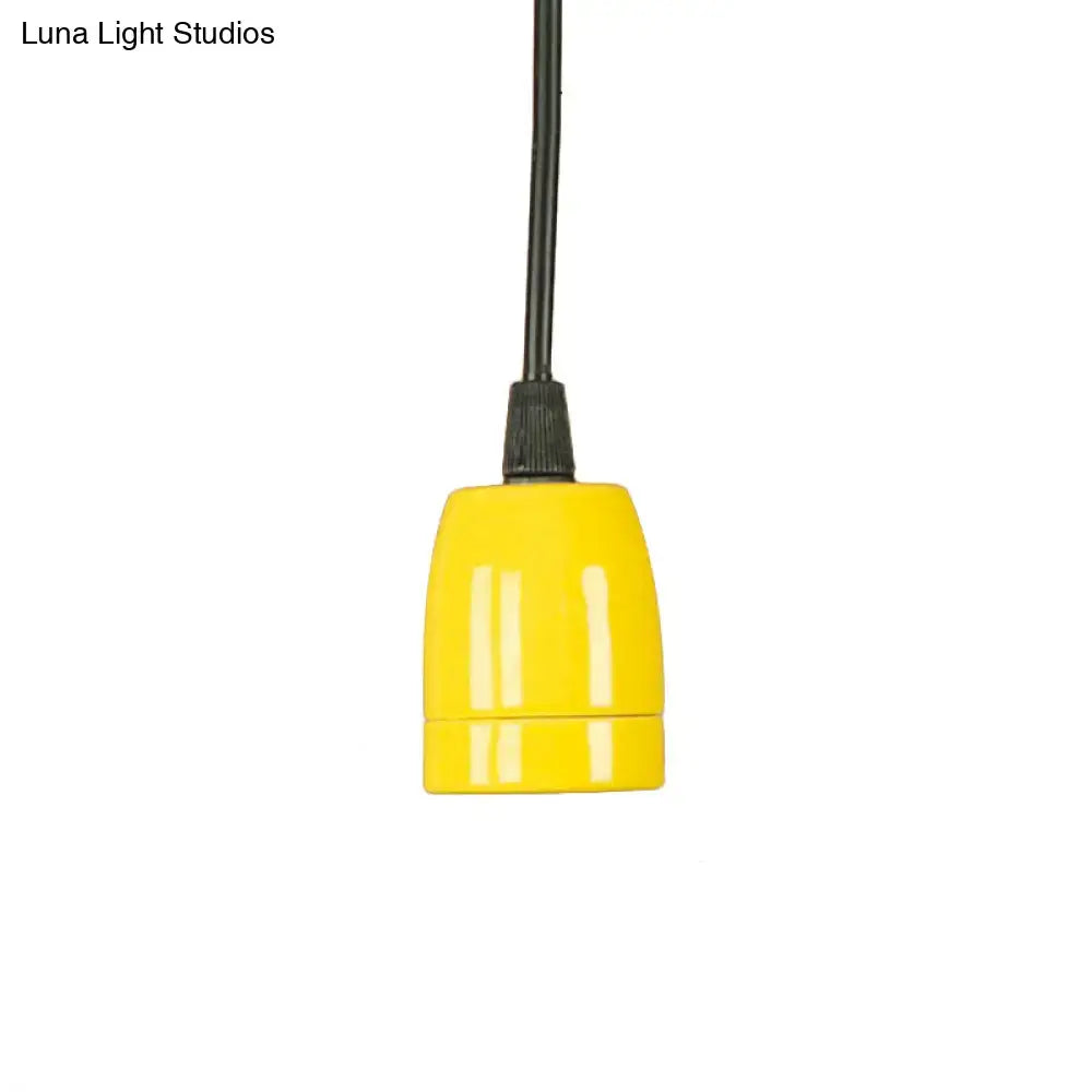 Bright yellow ceramic lamp socket with black cord for DecorBites™ pendant light with black red ceramic finish