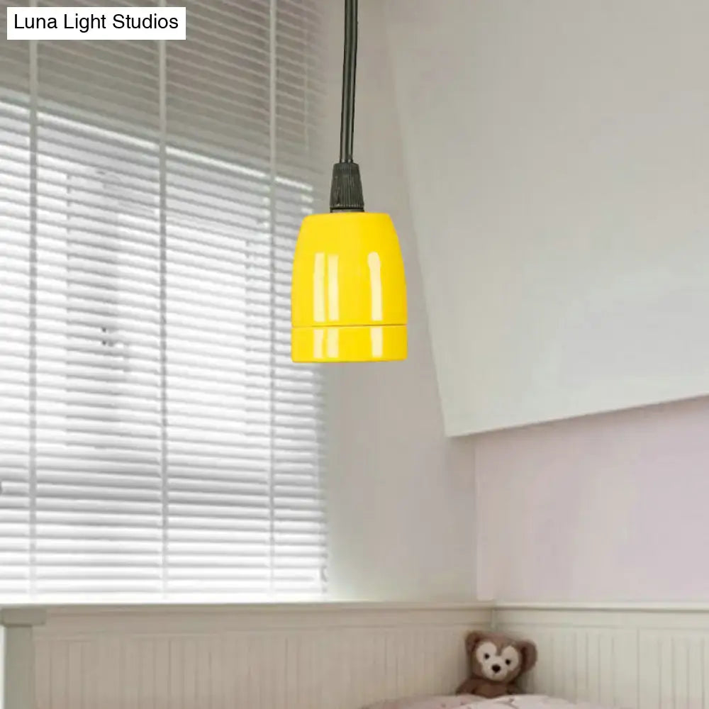 Bright yellow pendant light with sleek cylindrical design and black red ceramic ceiling fixture with adjustable cord