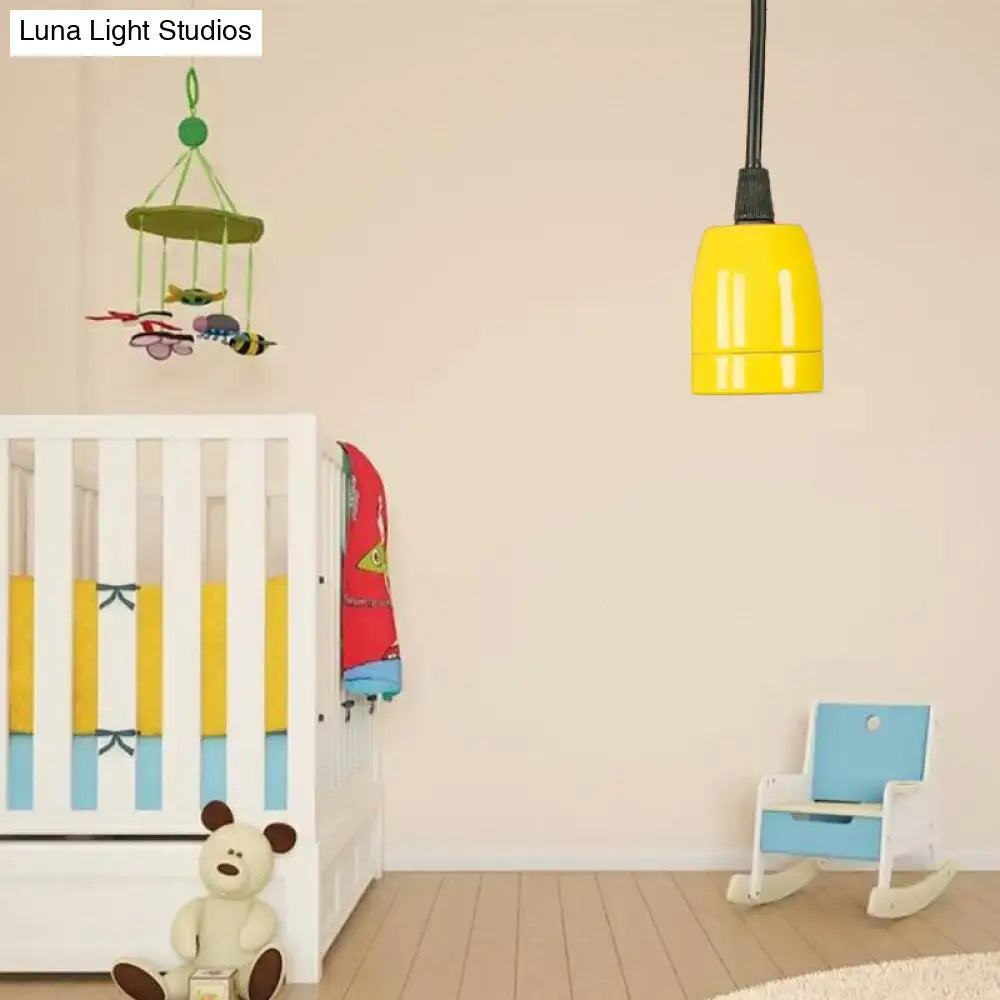 Bright yellow DecorBites™ pendant light with sleek cylindrical design, black red ceramic ceiling fixture, adjustable cord
