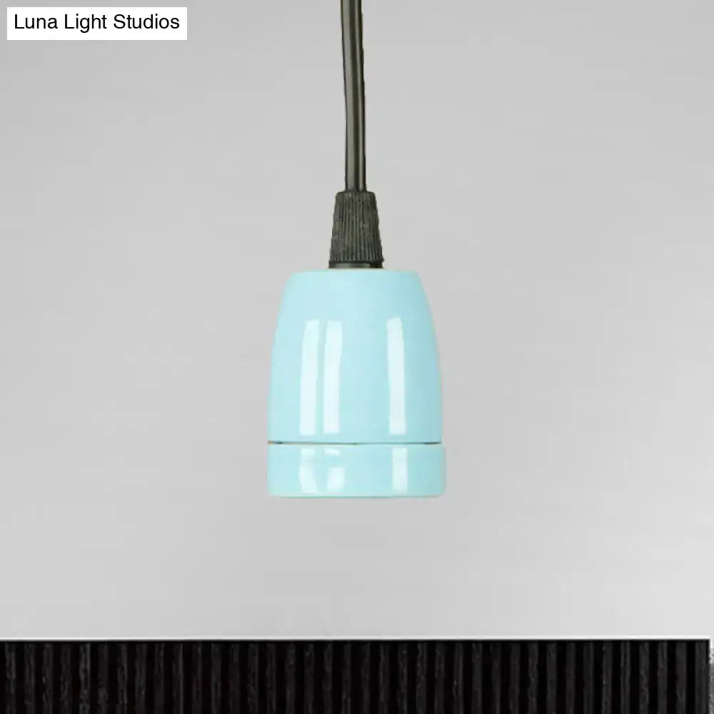 A sleek light blue ceramic lamp socket with matte finish and ribbed metal connector for black red ceramic pendant light