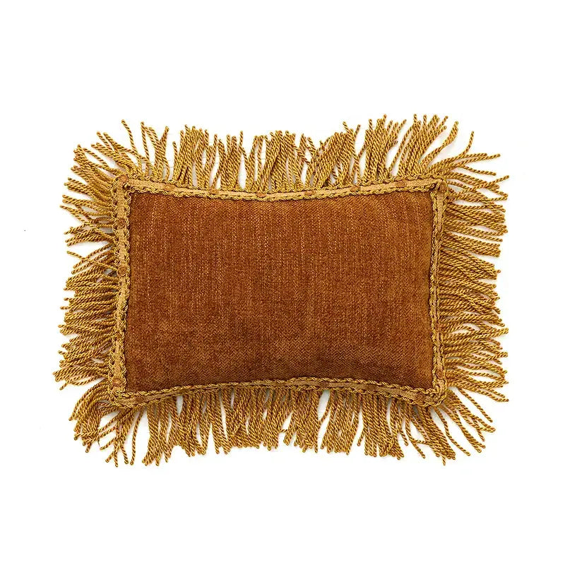 A rectangular mustard-colored textured cushion cover with golden fringes for decorbites american luxe retro decor