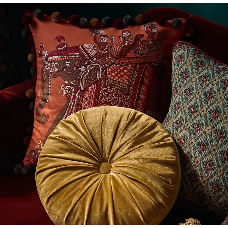 Golden velvet circular cushion with tufted center and pleated texture for decorbites american luxe cushion covers