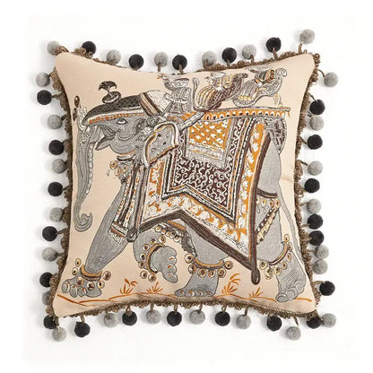 Beige cushion cover with embroidered elephant and black gray pom-poms by decorbites american luxe retro