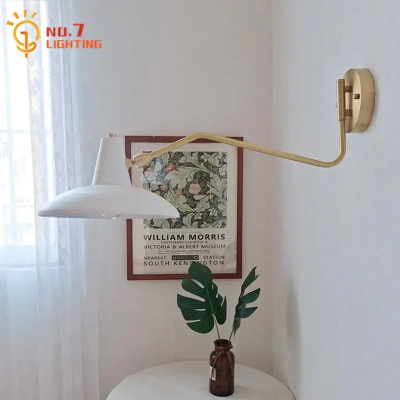 Gold-toned articulated wall lamp with white conical shade swing arm ideal for bedroom reading decorbites copper swing
