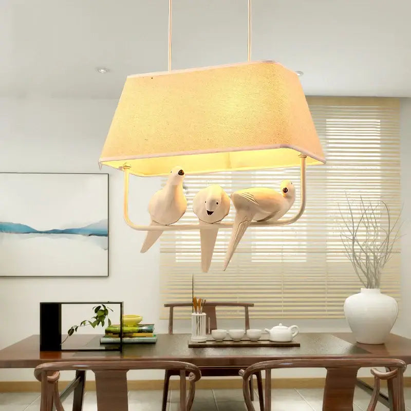 Cream-colored ceramic retro white resin bird cage chandelier with three bird figures under textured warm lampshade