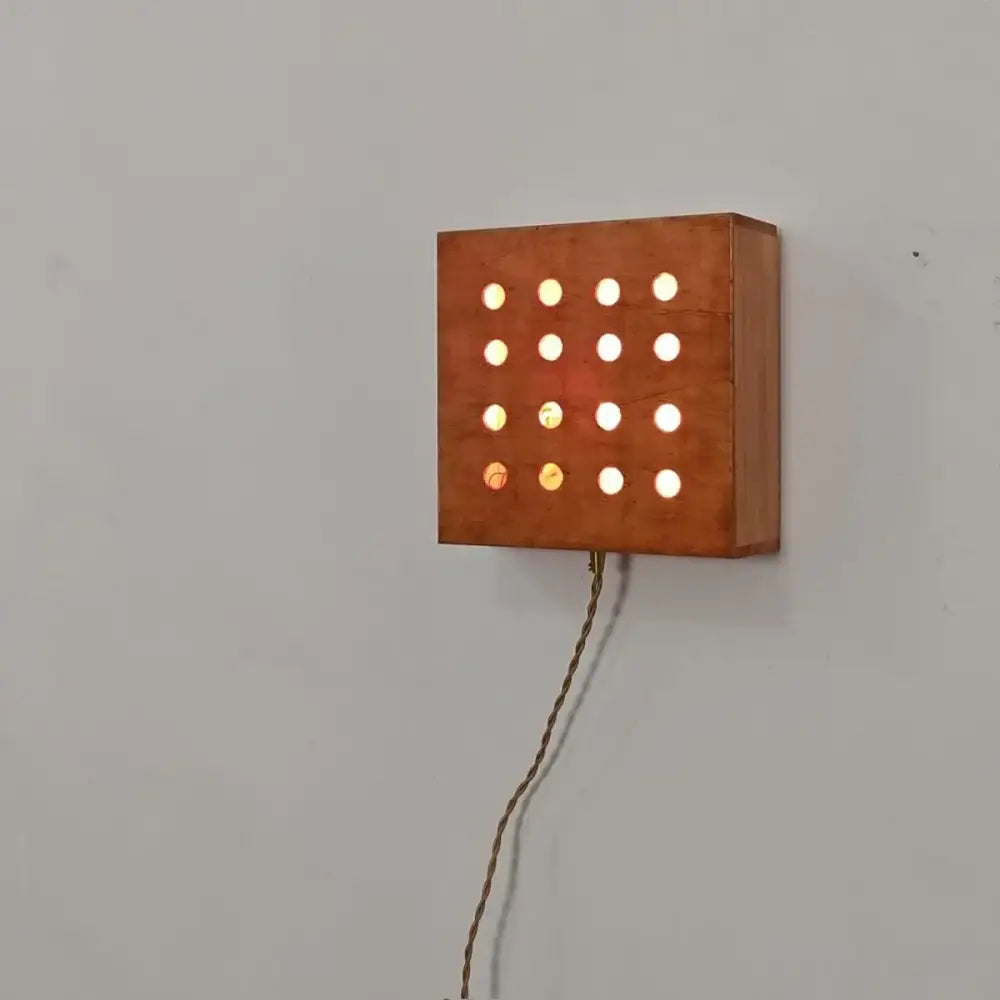 Warm-toned wooden decorbites cave box wall light with glowing circular lights for bedroom feature lighting