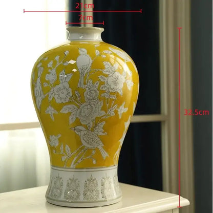 Retro yellow and white porcelain vase with intricate floral and bird motifs, glossy finish, ideal for living room decor