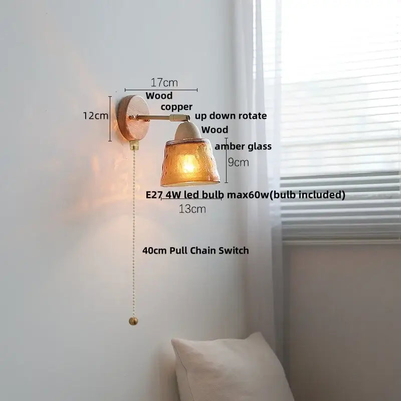 Copper and wood wall sconce light with amber glass shade and ribbed ceramic accent for bedroom wall sconce use