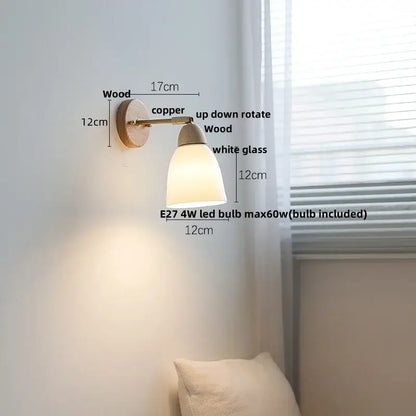 Minimalist wall sconce light with copper metal arm, wooden base, and white glass diffuser for bedroom use