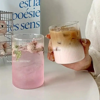 Two ribbed clear glass coffee tumblers from decorbites, one with pink liquid and one with iced coffee