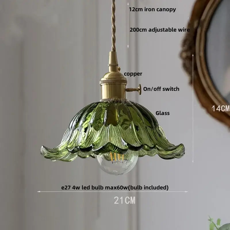 A delicate green decorbites clear glass led pendant light with fluted design and brass dining room knob switch