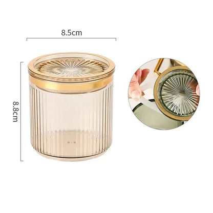 A clear ribbed acrylic seasoning jar with gold sunburst lid from the decorbites acrylic seasoning jar set