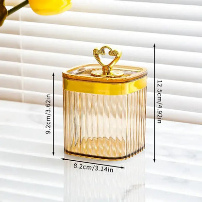 A translucent amber glass acrylic seasoning jar with gold metal lid and heart handle in decorbites seasoning jar set