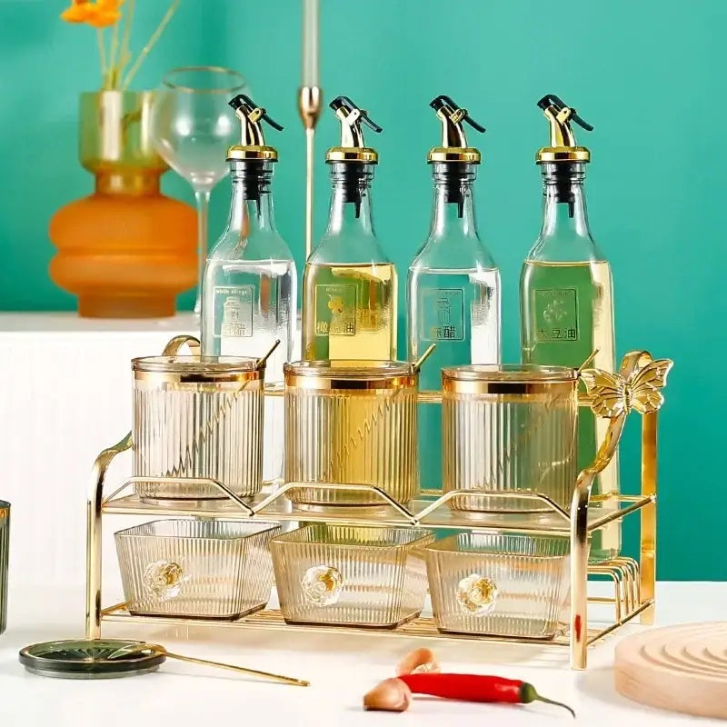 Gold-toned glass acrylic seasoning jar set with ribbed texture on matching gold metal stand for kitchen decorbites acrylic seasoning